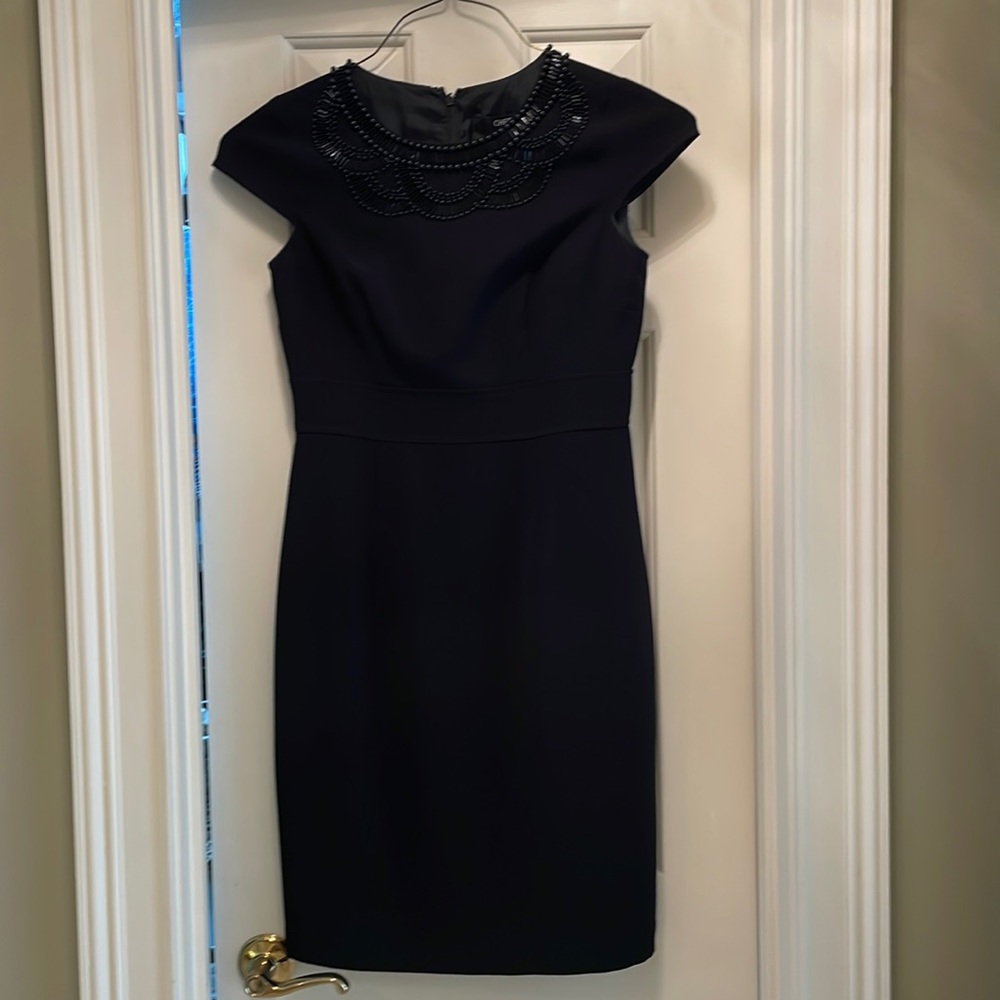 Black cocktail Chettab sunhee dress with beaded detail at top. Size 4.